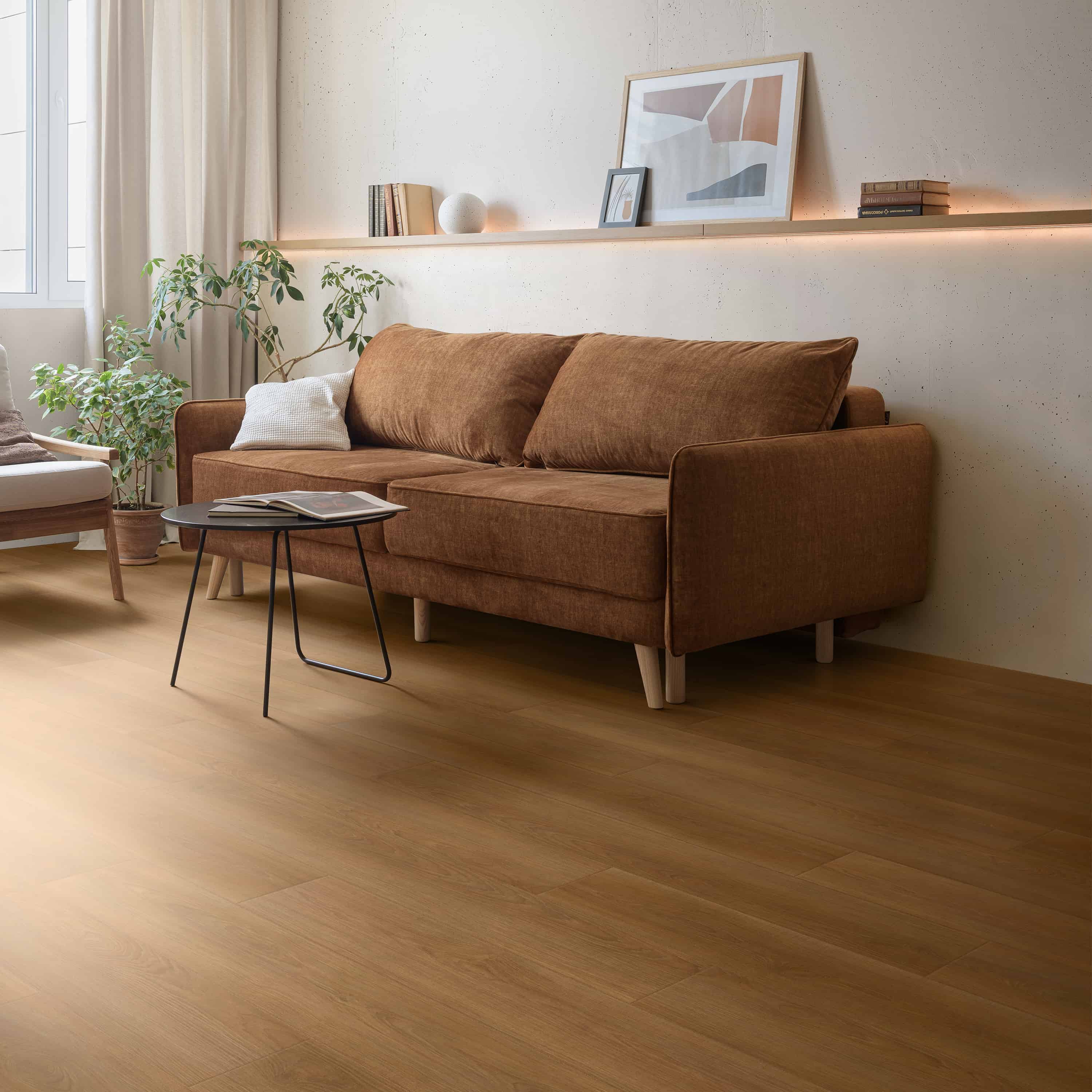SPC rigid core vinyl plank floor in warm oak laid through a sunlit living room